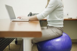 sitting on a yoga ball