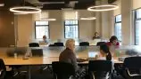 an open work space with 5 people working