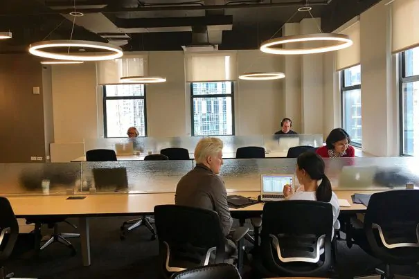 an open work space with 5 people working